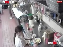 Before serving, a pervert waitress dips a hot dog into her wet cunt.